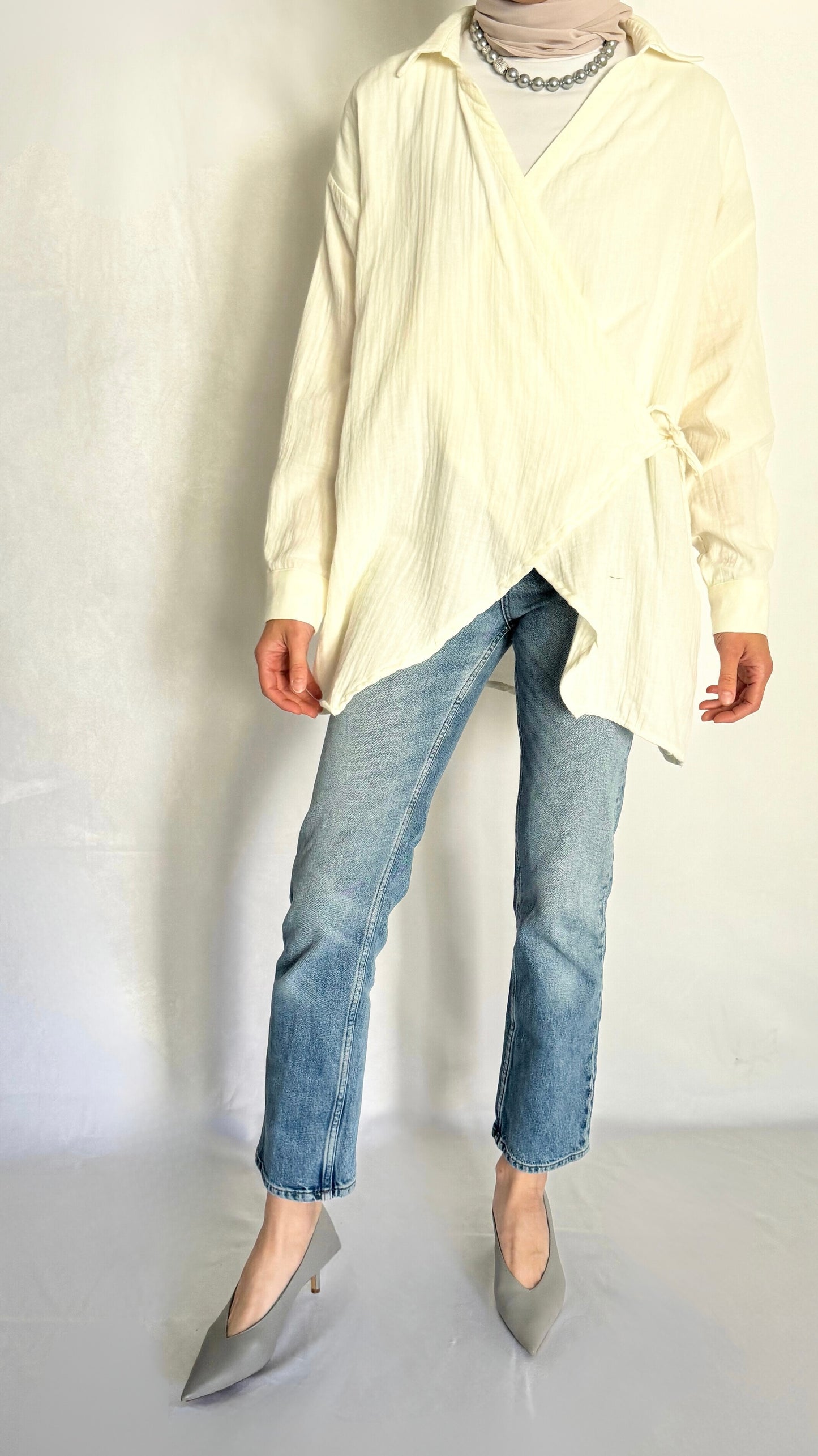 Oversized cotton ivory shirt that drapes nicely, paired with jeans.