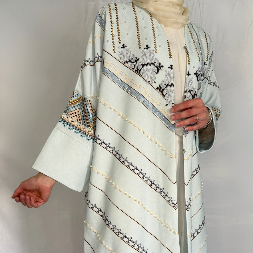 unique details of our masterpiece abaya in light colors
