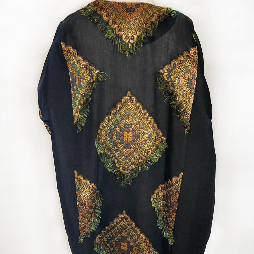 Sheer Back of a black Abaya with green design