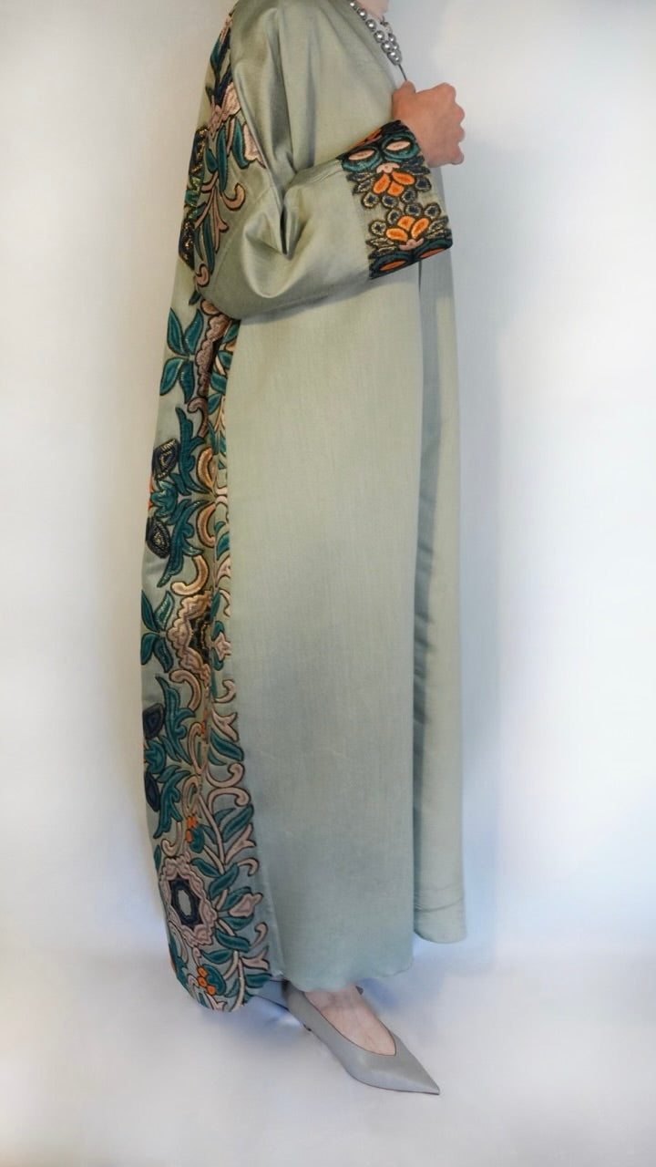vibrant Abaya, a fusion of tradition and modernity. With colorful details in the back