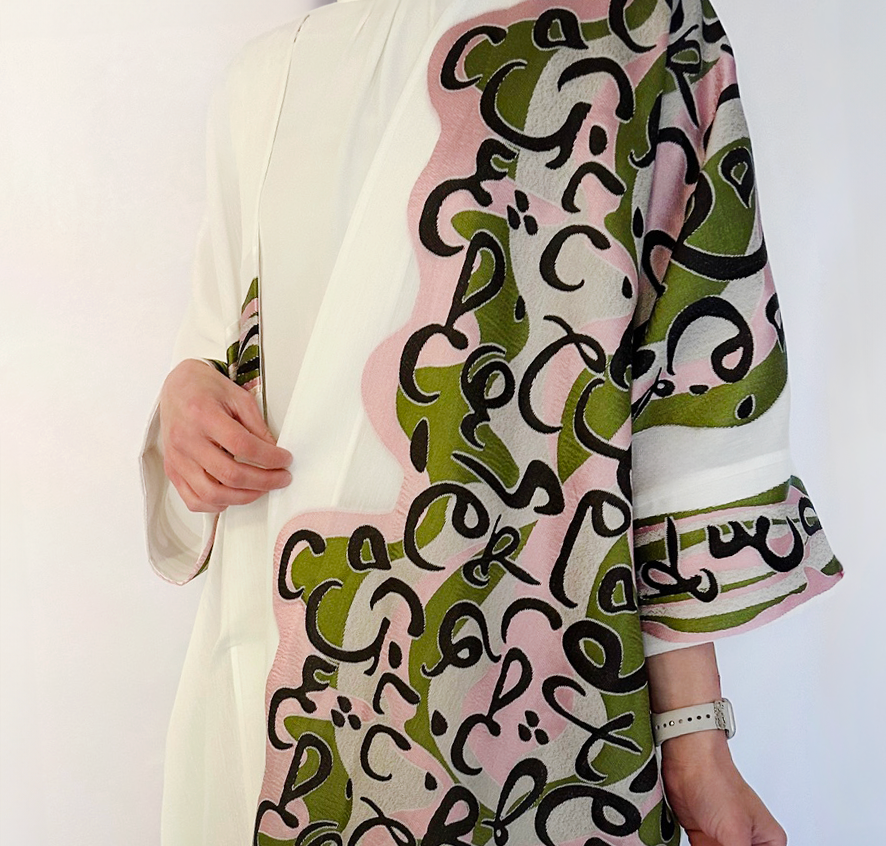 luxurious oversized offwhite bisht with arabic calligraphy in pink