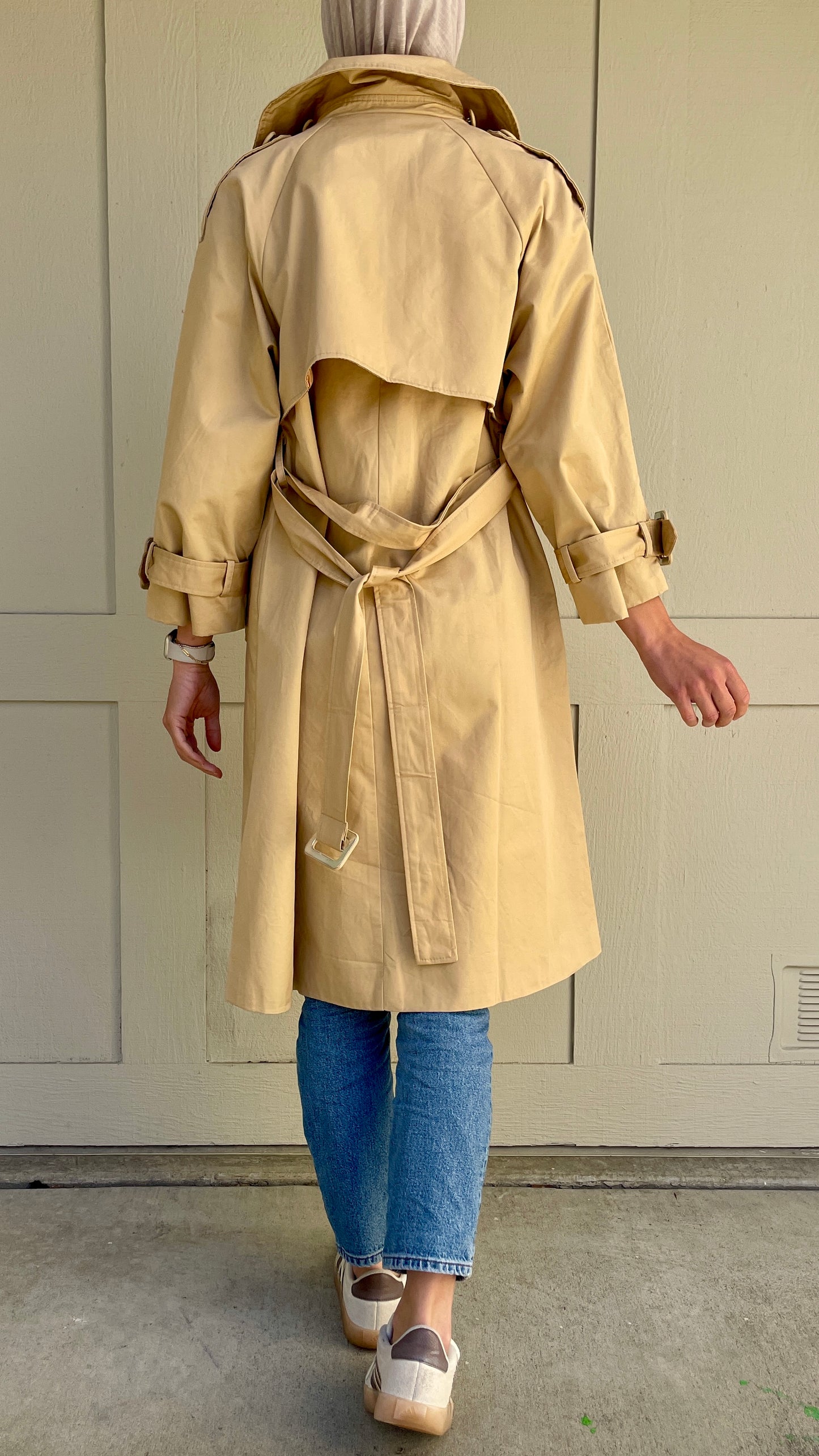 Beige trench coat in the back