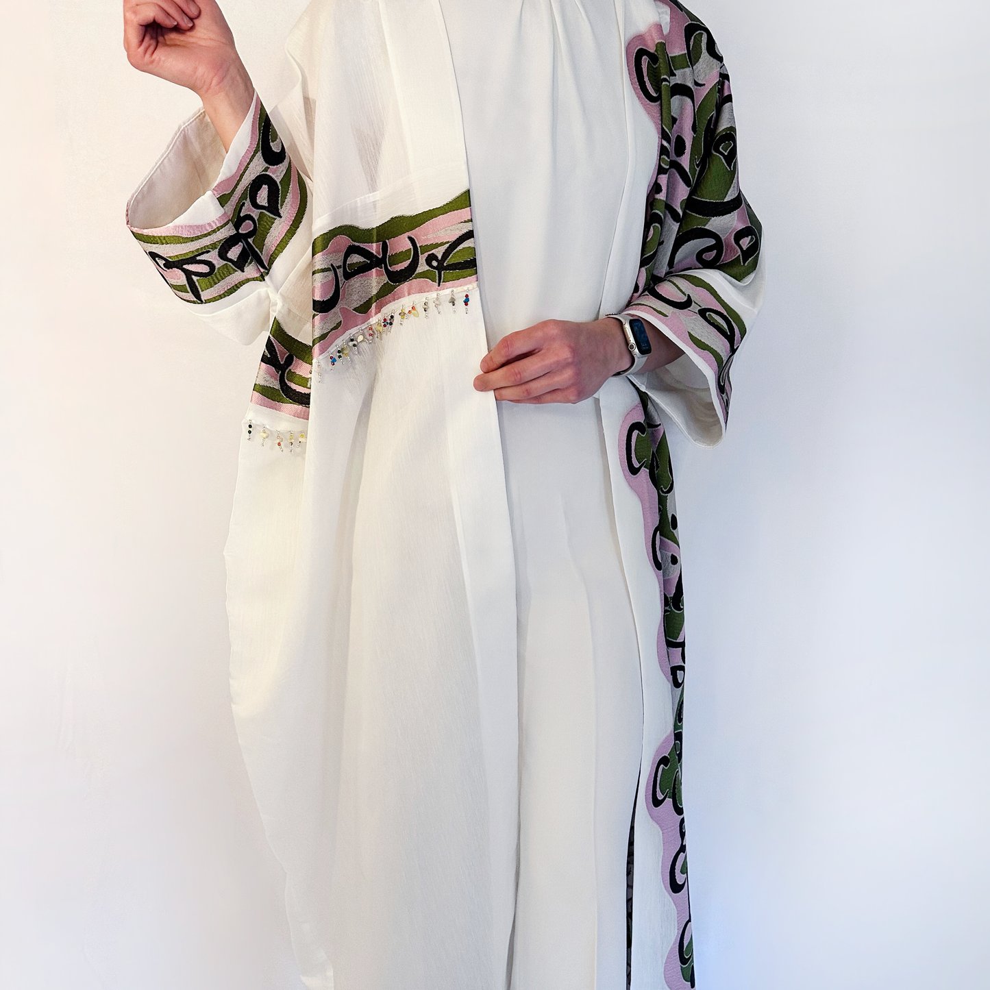 luxurious oversized offwhite bisht with arabic calligraphy in pink