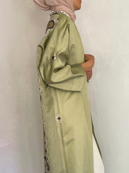 side view of the beautiful abaya. Pistachio colored abaya with detailed back design 