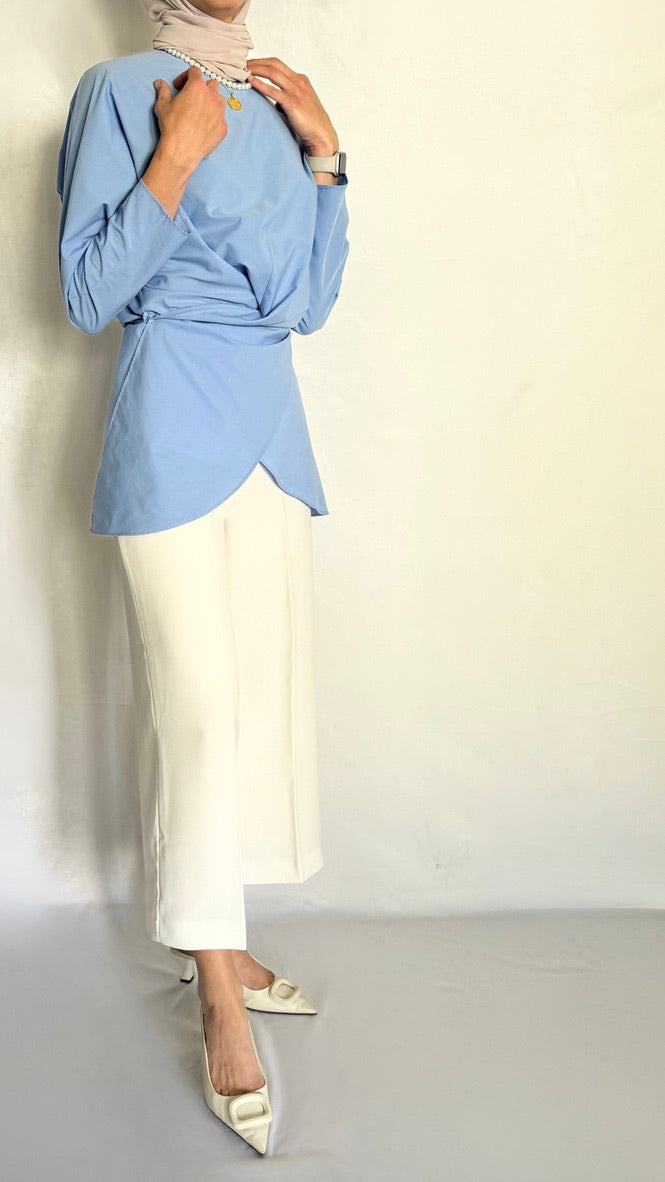 Front view of the ocean breeze tunic. The shirt has a tie wrap. Can be dressed up and down.