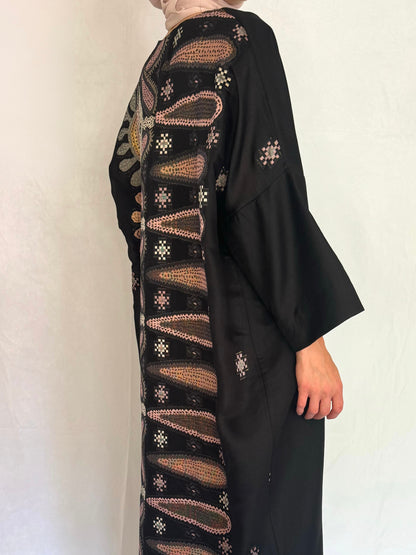 Side view of the abaya showing the back pattern design.