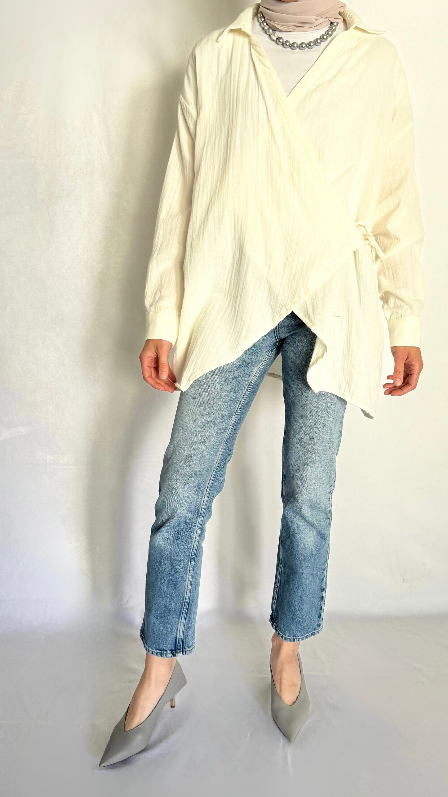 Oversized cotton ivory shirt that drapes nicely, paired with jeans. 