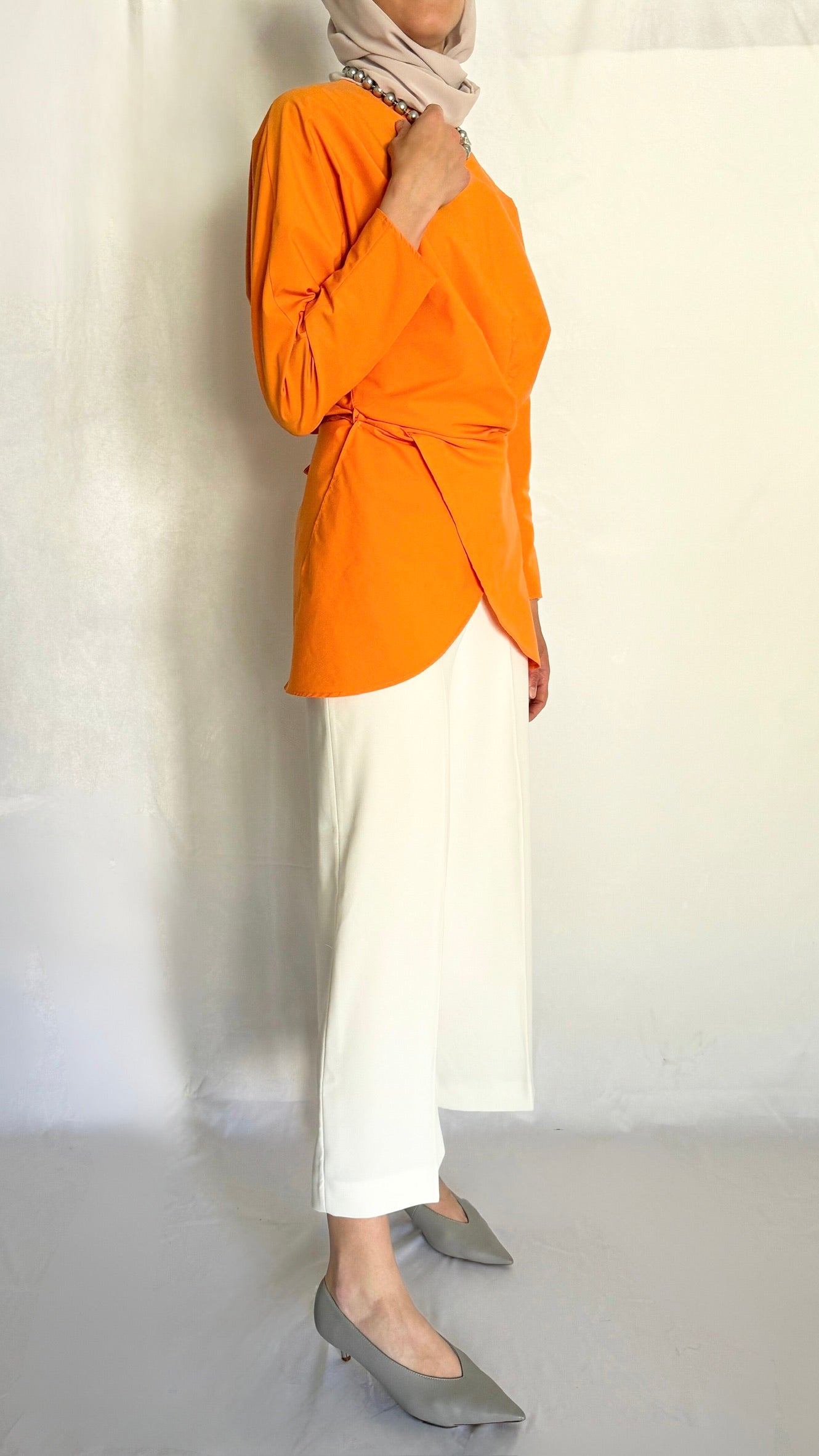 Chic Orange shirt with waist tie, a staple piece this summer 