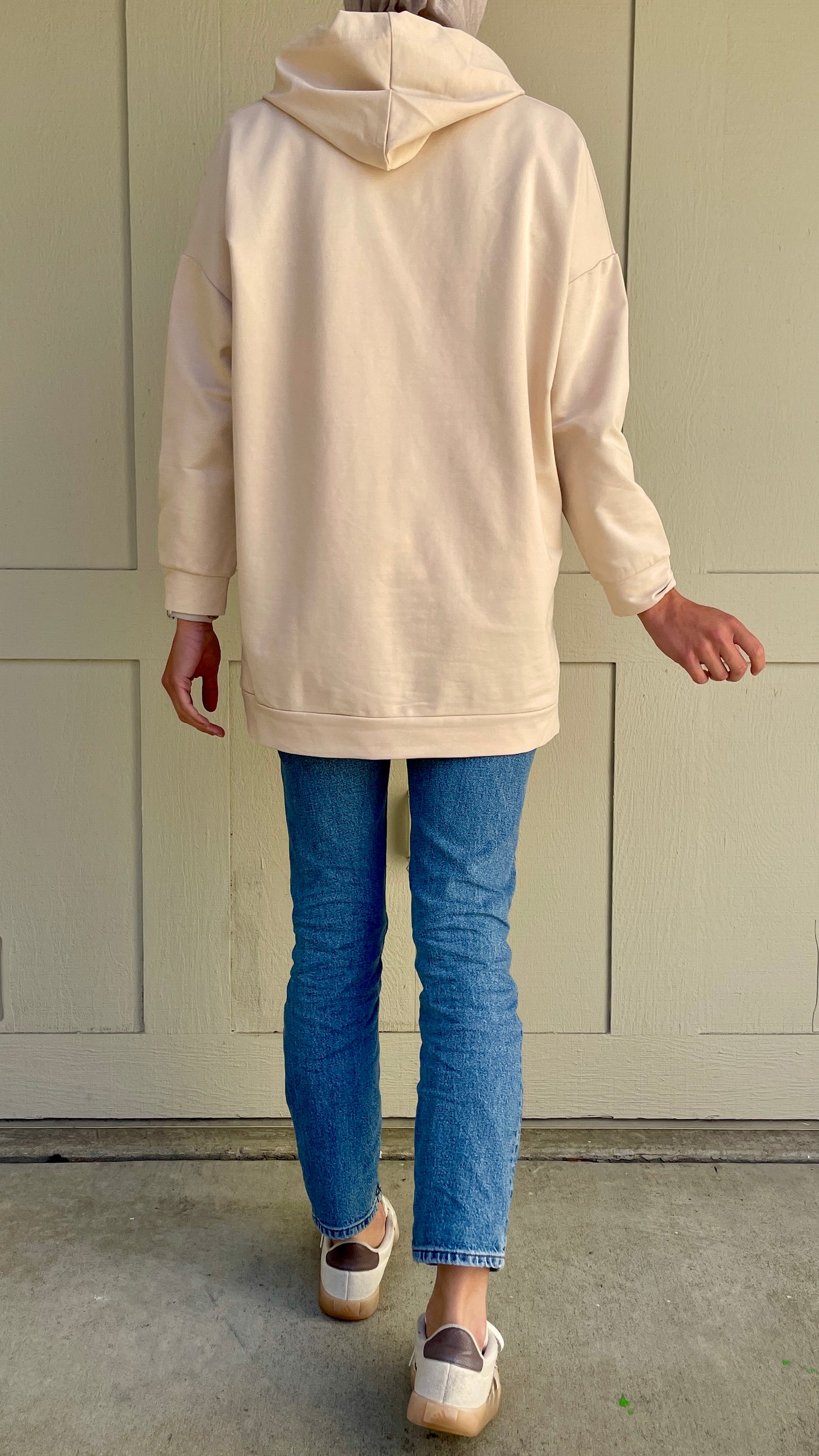 Back view of the modest hoodie in cream 